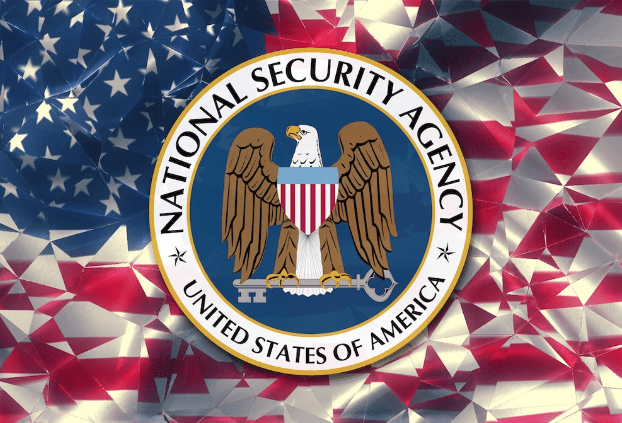 An image of the U.S. flag with the National Security Agency (NSA) logo superimposed over it, symbolizing American cybersecurity, surveillance, or government intelligence.