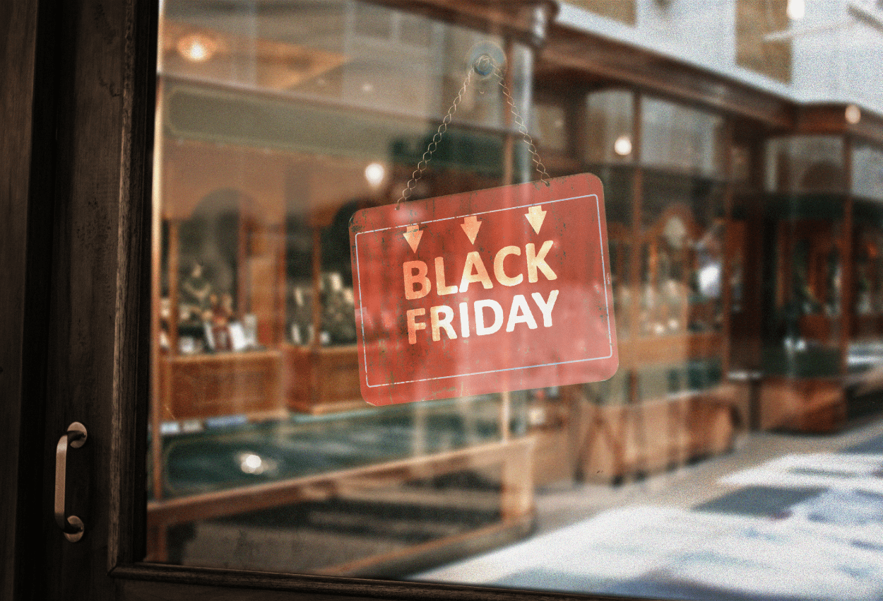A Black Friday sign hanging in a store window, representing the busy shopping season when phishing scams often increase around Black Friday and Cyber Monday.