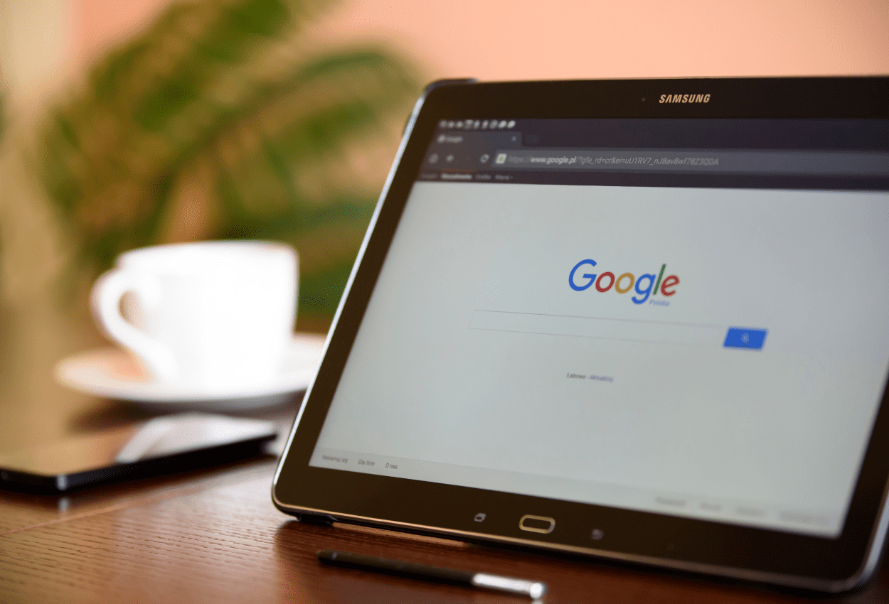 User browsing online on a tablet, representing everyday exposure to malware risk from malicious browser extensions.